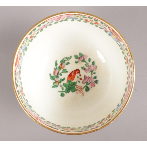 457 - A Royal Worcester hand-painted small bowl and saucer. Decorated in the Worcester parrot pattern with... 