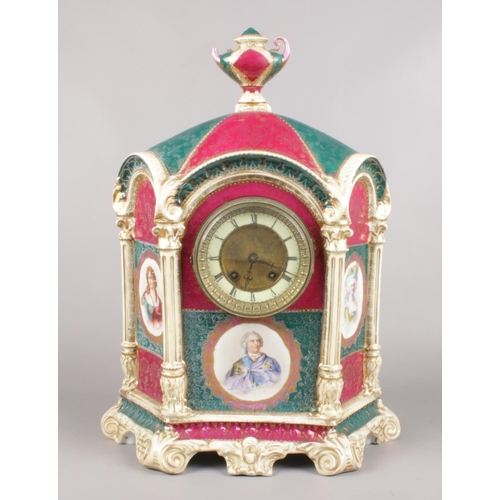 69 - A large decorative pottery mantel clock. Decorated with figural panels depicting Louis XV, Duchess D... 