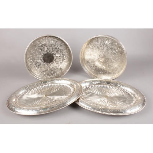 71 - Four silver plated trays - comprising of two handmade circular trays and two oval trays with the nam... 