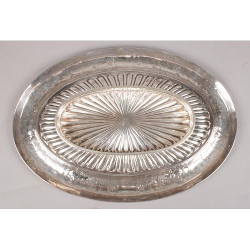 71 - Four silver plated trays - comprising of two handmade circular trays and two oval trays with the nam... 