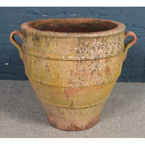 483 - A large terracotta garden planter. (height 61cm, diameter 60cm).