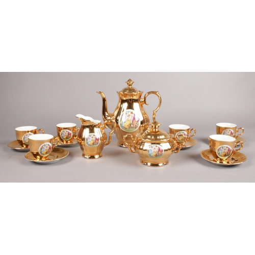 74 - A Gold Lustre coffee set. 'Epiag D.F Czechoslovakia' Coffee pot, milk jug, cups/saucers examples etc