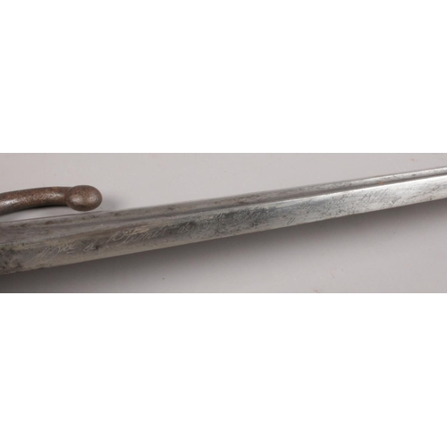 75 - A French 1868 pattern sword bayonet in scabbard. With brass grip. Inscription to edge of blade. Hilt... 