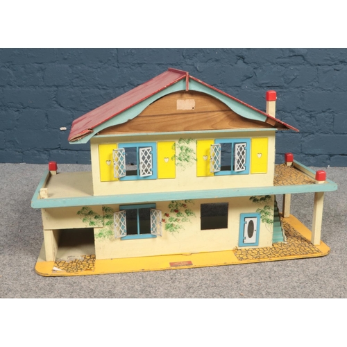 512 - A Gee Bee Toys wooden dolls house. (68cm width, 42cm height, 29cm depth)