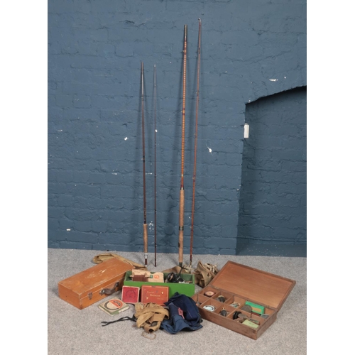 525 - A collection of vintage fishing equipment. Includes Milward's and Bruce & Walker rods, floats, Garci... 