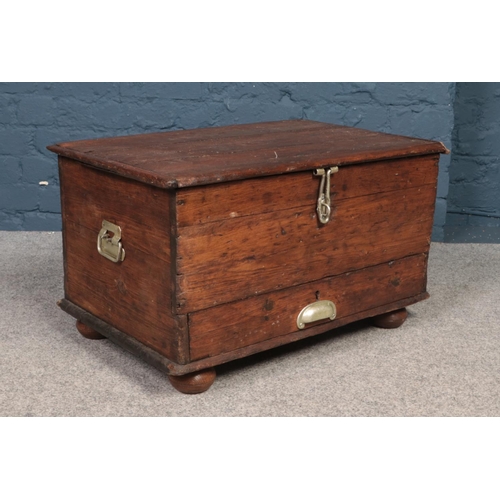 538 - An antique twin handle pine chest with drawer to base.