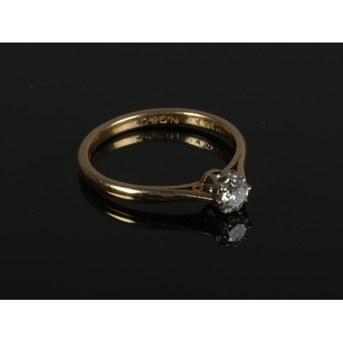 571 - A 18ct yellow Gold & Platinum Solitaire Diamond ring size M. approx. 1/8. Weight: 2.4g.