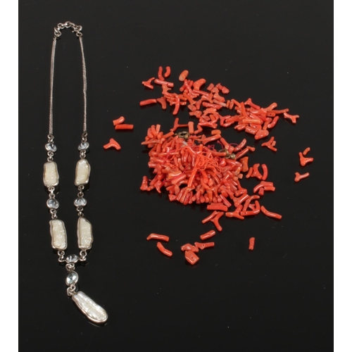 602 - A cinnamon coral necklace together with a silver pendant necklace inset with mother of pearl and ice... 