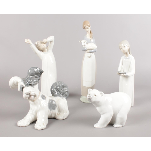 455 - Five Lladro figures. Polar Bear, dog, girl walking with candlestick examples etc. (28cm tallest)