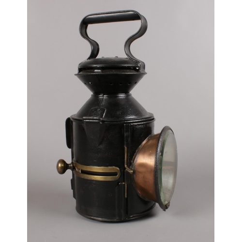 473 - A Railway 3 aspect sliding knobs handlamp. (33cm height)