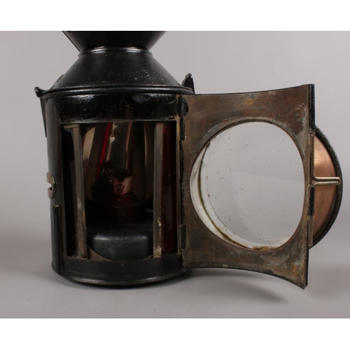 473 - A Railway 3 aspect sliding knobs handlamp. (33cm height)