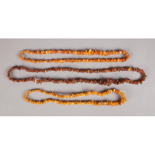 586 - Three natural amber necklaces. One cognac, the other two butterscotch.