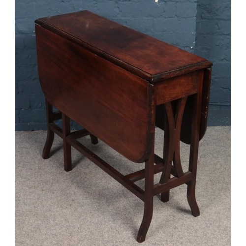 387 - An Edwardian mahogany Sutherland table.