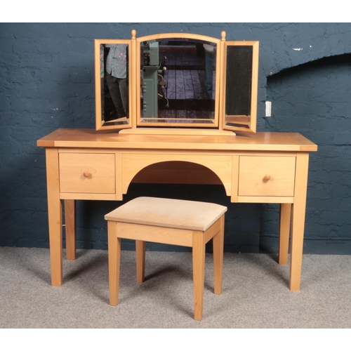 392 - A collection of Beech bedroom furniture - comprising of a dressing table with matching stool, mirror... 