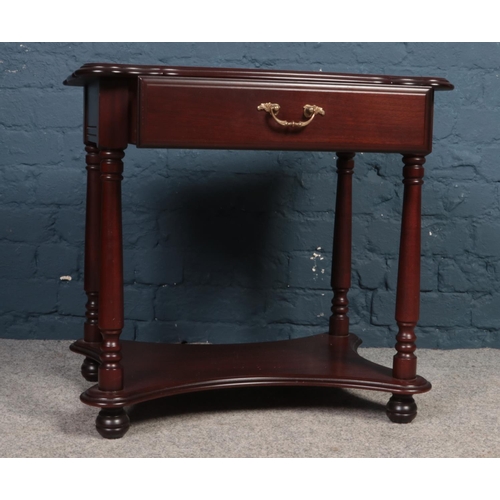 395 - A Mahogany occasional table with single drawer made by 'Rossmore'. H: 61cm, W:63.5cm, D:47.5cm.