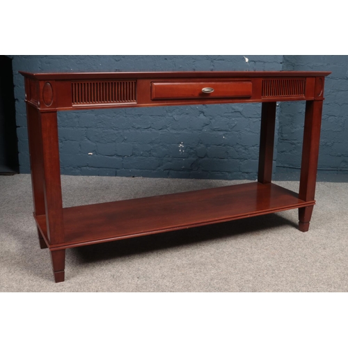 398 - A Mahogany console table with central drawer. Made by (Theseira). H:71.5cm, W:120cm,