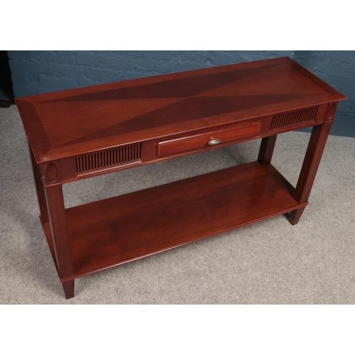 398 - A Mahogany console table with central drawer. Made by (Theseira). H:71.5cm, W:120cm,