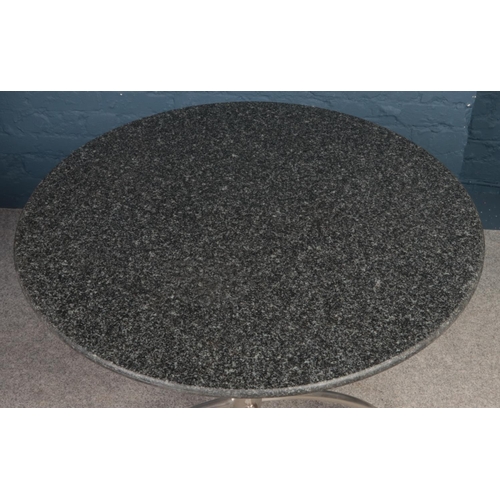 403 - A circular granite topped bistro table & two leatherette chairs. 
Table: H: 75cm, D:90cm.