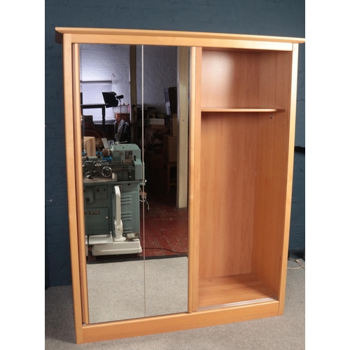 407 - A large Beechwood double wardrobe with twin sliding mirrored doors (164cm width, 214cm height, 62.5c... 