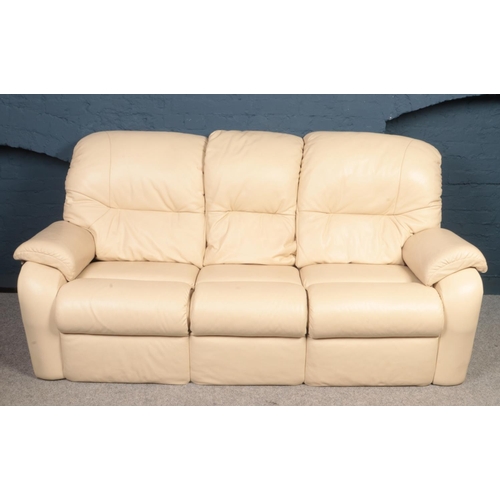 410 - A 'G-Plan' three seater sofa together with two matching electric recliners in cream leather. 
Sofa: ... 