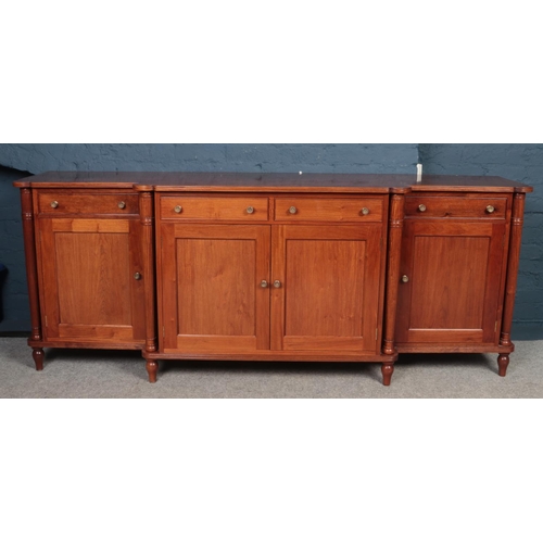 411 - A good quality Regency style figured mahogany breakfront sideboard - comprising of 3 cupboards and 4... 