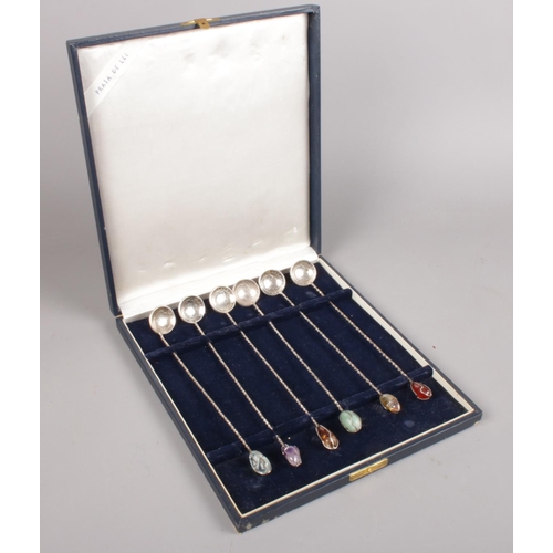 431 - A set of 6 Brazilian silver 2000 reis coin spoons. With white metal twisted shafts and assorted gem ... 