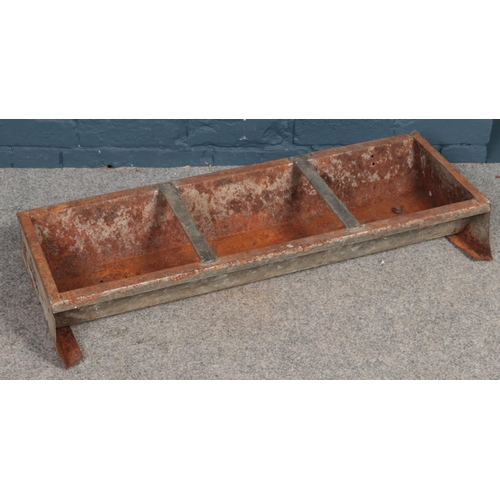 479 - A galvanised steel feeding trough. (90cm long)