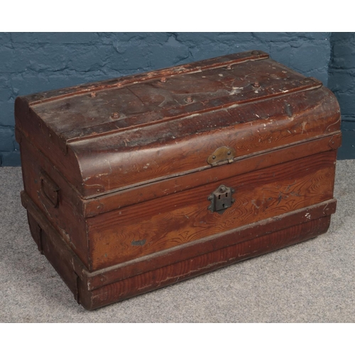 500 - A dome top twin handled tin trunk.