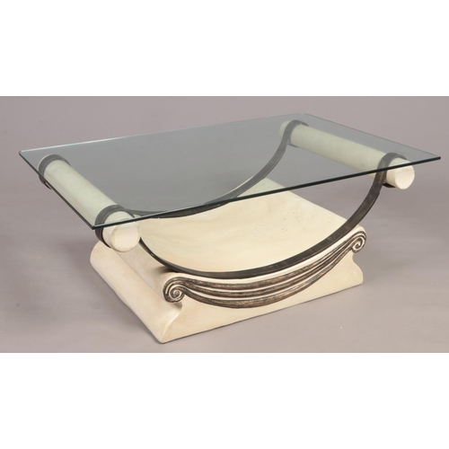 312 - An Italian design composite and metal marble effect glass top coffee table.