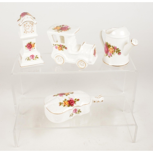 68 - Four pieces of 'Cottage Rose' Bone China - Comprising of a watering can, car, cello with lid and a g... 