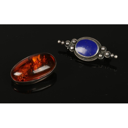 216 - An Amber cognac brooch & a silver hardstone example.