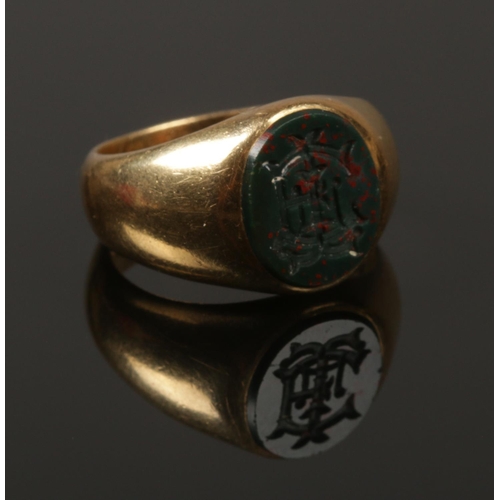 230 - A Victorian 18ct gold bloodstone seal ring. 12.99g. Size S.