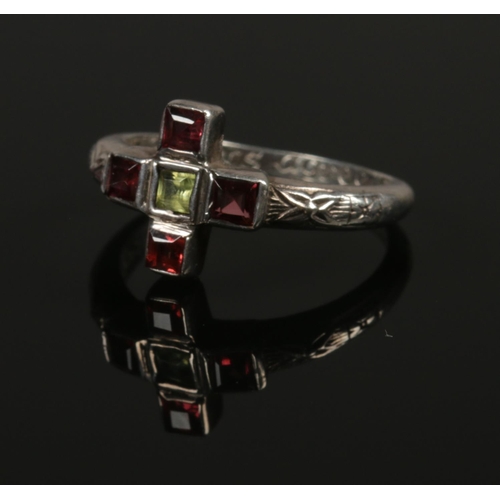 240 - A silver poetry ring with garnet set crucifix. Where Hearts Agree God Will Be. Size S. 4.4g.