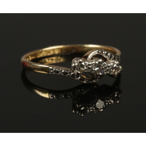 242 - An 18ct gold, platinum and diamond ring. Size P. 2.82g.