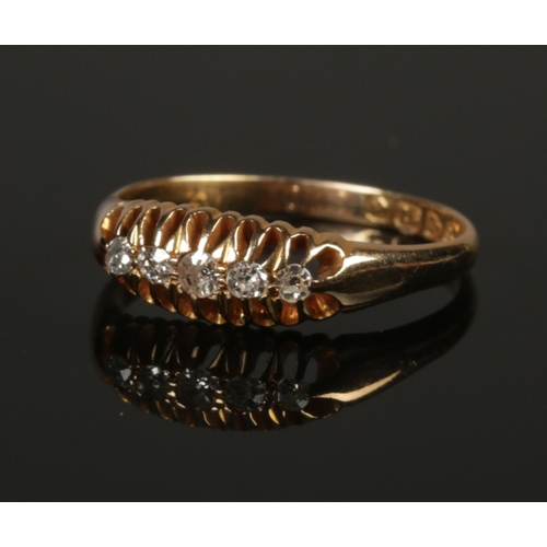 243 - A George V 18ct gold five stone diamond ring. Assayed Chester 1915. Size P. 2.84g.