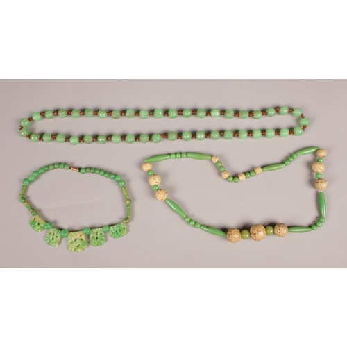 270 - Three Art Deco bead necklaces. One with dragon decoration.