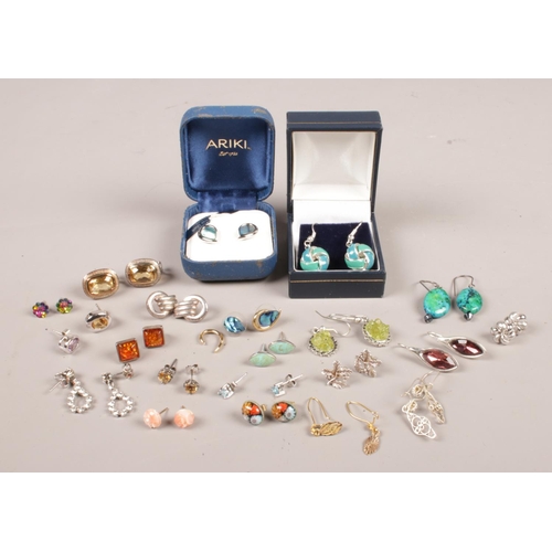 278 - A collection of earrings. Approximately 20 pairs. Includes pau shell, amber etc.