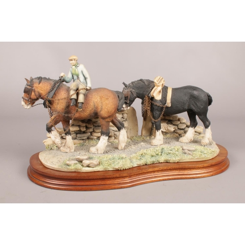 284 - A Border Fine Arts figure depicting two working Shire Horses with figure on wooden plinth- signed by... 