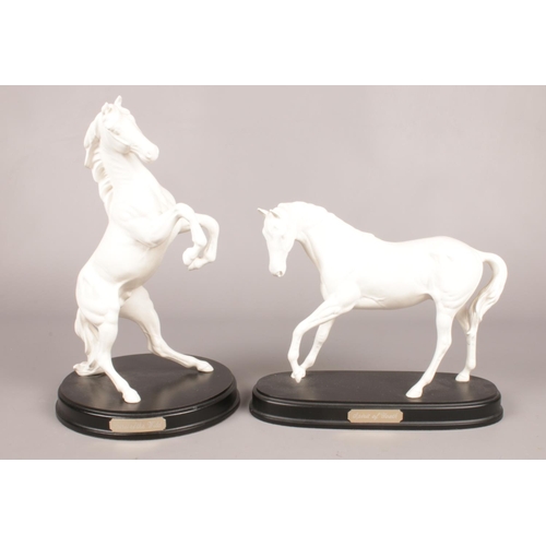 293 - Two Royal Doulton white horses - (Spirt of the Wild & Spirt of Youth), on wooden plinths. Tallest H:... 