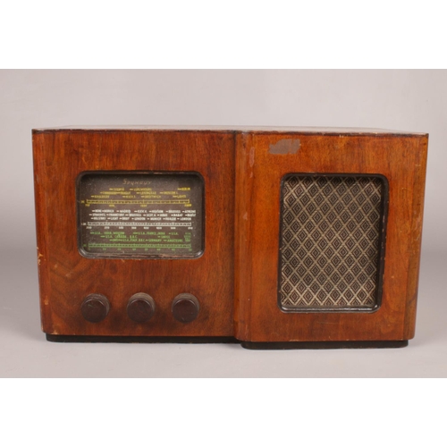 368 - A Seymour 1940's vintage wooden cased valve radio. 24.5 cm height, 44cm width, 23cm depth.