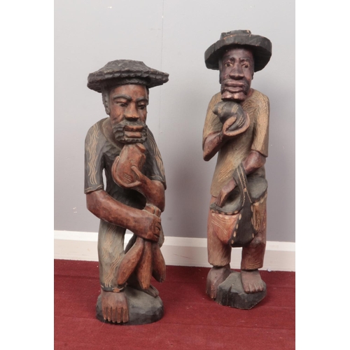 369 - Two wooden carved figures. (77cm height tallest)