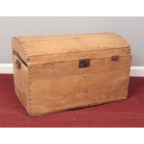 370 - A Pine twin handled dome top chest. (76cm width, 48cm height, 46cm depth)