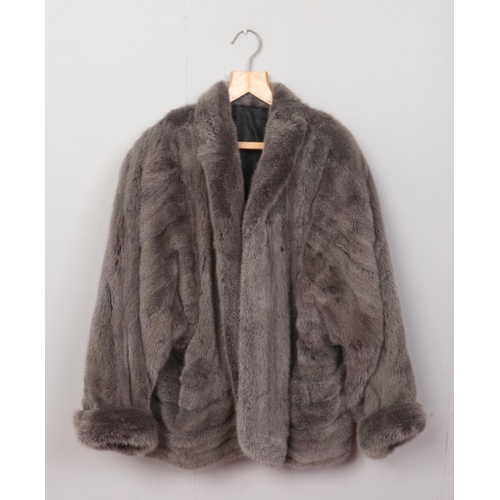 378 - A vintage ladies grey fur jacket, from Harry Fish of Chesterfield. Approx. size L. 
Length: 74cm.