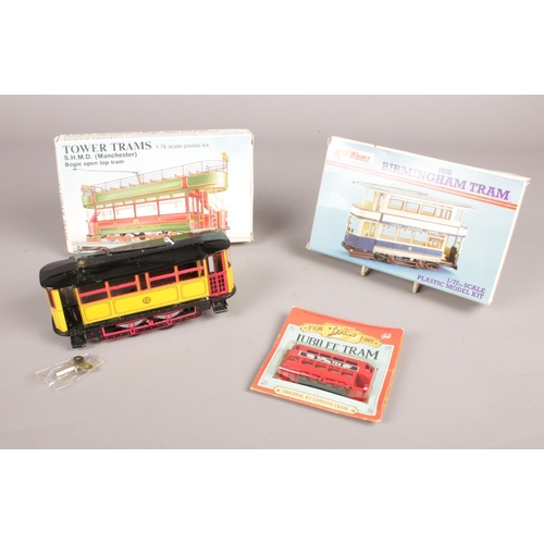 382 - A group of Tram collectables .Tin Plate Wind up Tram with Key, Tower Trams 1.76 scale plastic model ... 