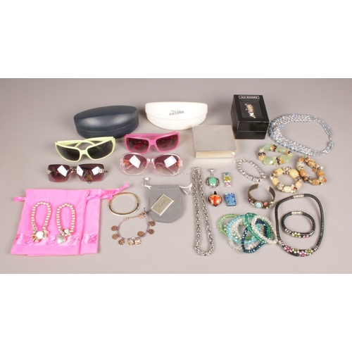 429 - A selection of designer style sunglasses with costume jewellery. To include a boxed pair of Tommy Hi... 