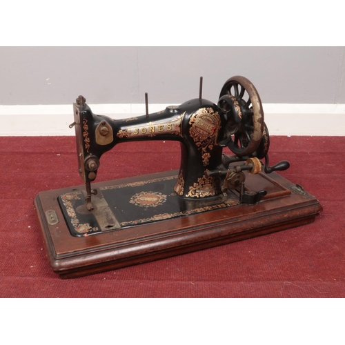 454 - A Jones hand crank sewing machine.