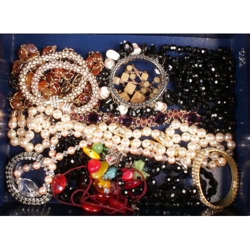 95 - A box of costume jewellery. Includes cultured pearl and rock crystal necklace, paste bracelets etc.