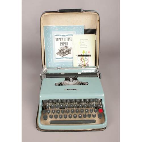 106 - Olivetti Lettera 22 Typewriter with Original Case, Instructions and Typewriting Paper.