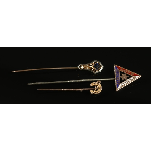 249 - Three stick pins. Includes 10ct gold example with blue stone, 9ct gold equestrian example and one ot... 