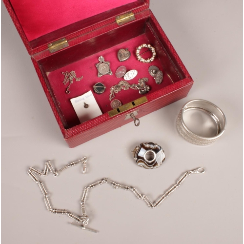 274 - A jewellery box with contents. Includes bangle, double albert chain, silver cricket fob etc.